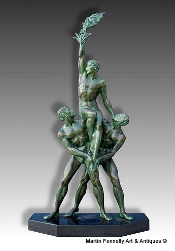 128 Sold Pierre Le Faguays 'Tropheé' a green patinated bronze figural Group, circa 1925
