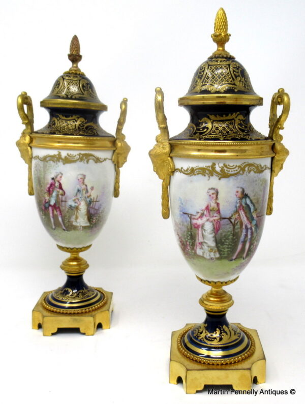 446 Sold Pair French Sevres Hand Painted Porcelain Ormolu Mounted Urns late 19thCt
